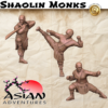 3D render of three Shaolin Monk miniatures for 3D printing. The warrior monks are in dynamic martial arts poses: one with a dao sword, one performing a high kick, and one in a horse stance. Part of the Asian Adventures collection.