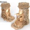 3D render of a ruined fantasy watchtower designed as a dice tower. The model features a cylindrical stone base with crumbling walls, an internal spiral ramp, and a wooden palisade platform on top.
