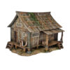 A 28mm scale 3D printed model of an Ishioki-Minka, a traditional Japanese mountain farmhouse. The structure features a unique roof made of flat wooden planks weighted down by numerous realistic stones, a raised timber porch (Engawa) with steps, and weathered wood-grain siding, all set on a stone-pillared foundation.