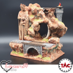 A 3D printed and painted model of The King's Pass, a fantasy terrain piece featuring a rocky cliff, a large statue of a medieval king, a stone bridge with a railway line, and a tunnel.