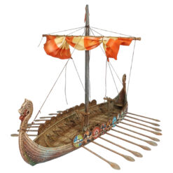 A fully painted 3D printed model of a Viking Drakkar longship. The model features a detailed wooden texture, a dragon head prow, a row of colorful shields along the gunwale, oars, and a single mast with a furled orange sail.