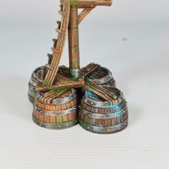 A 3D printed and painted model of a tall wooden ladder on a platform supported by three barrels. The terrain piece is painted with realistic wood and metal textures, suitable for 28mm tabletop wargaming.