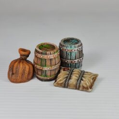 A hand-painted 3D printed miniature of a wooden barrel, held between fingers. The barrel has green staves, silver-painted bands with rivets, and a weathered top.