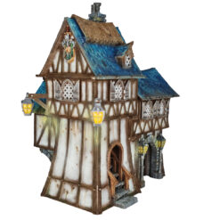 3D printed and painted model of the Oldkeep Barracks, a medieval half-timbered building with blue shingled roofs, hanging lanterns, and wooden textures for tabletop gaming.