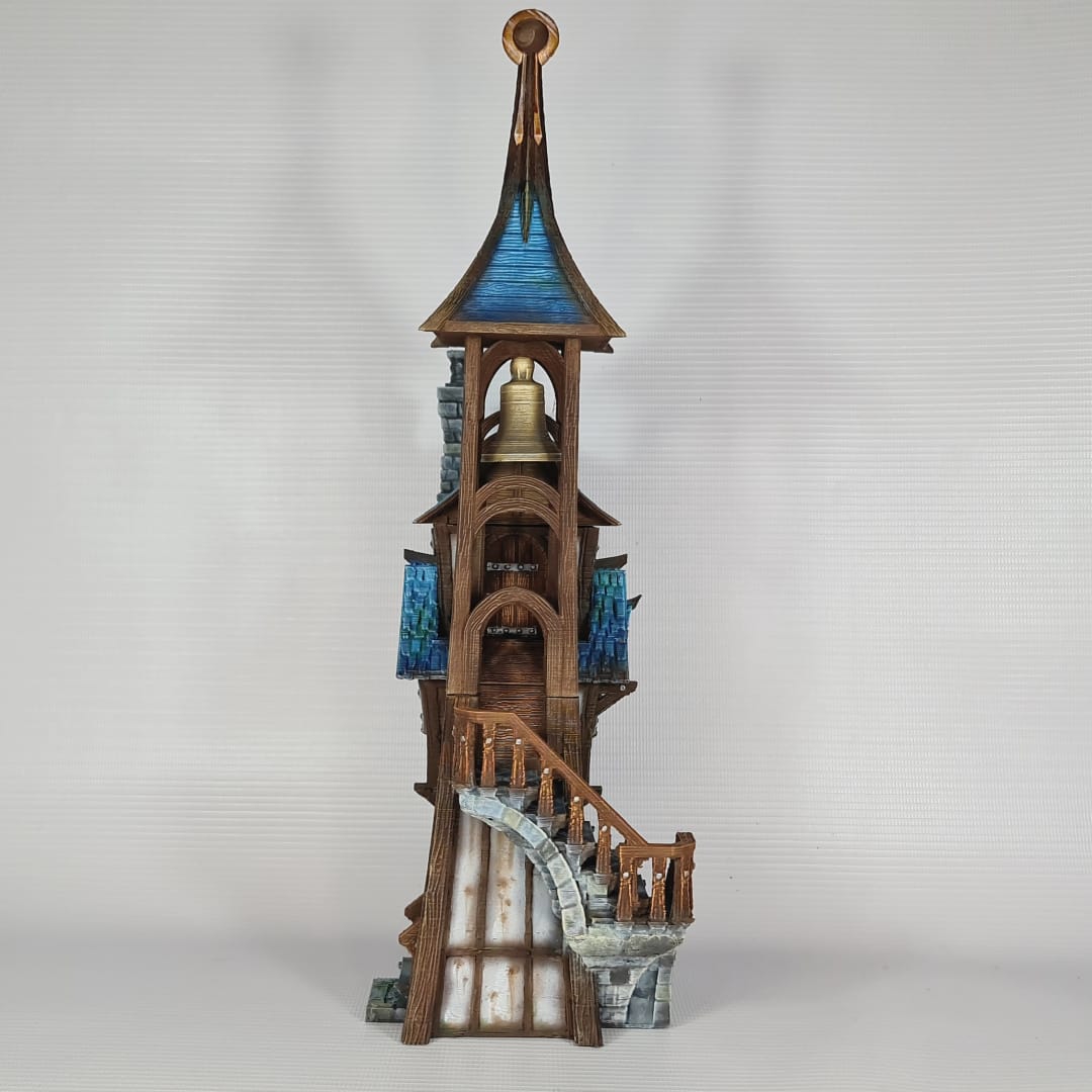 3D printed and painted model of Parson's Lodge, a tall medieval fantasy bell tower with half-timbered walls, blue shingled roofs, stone chimney, and wooden stairs.